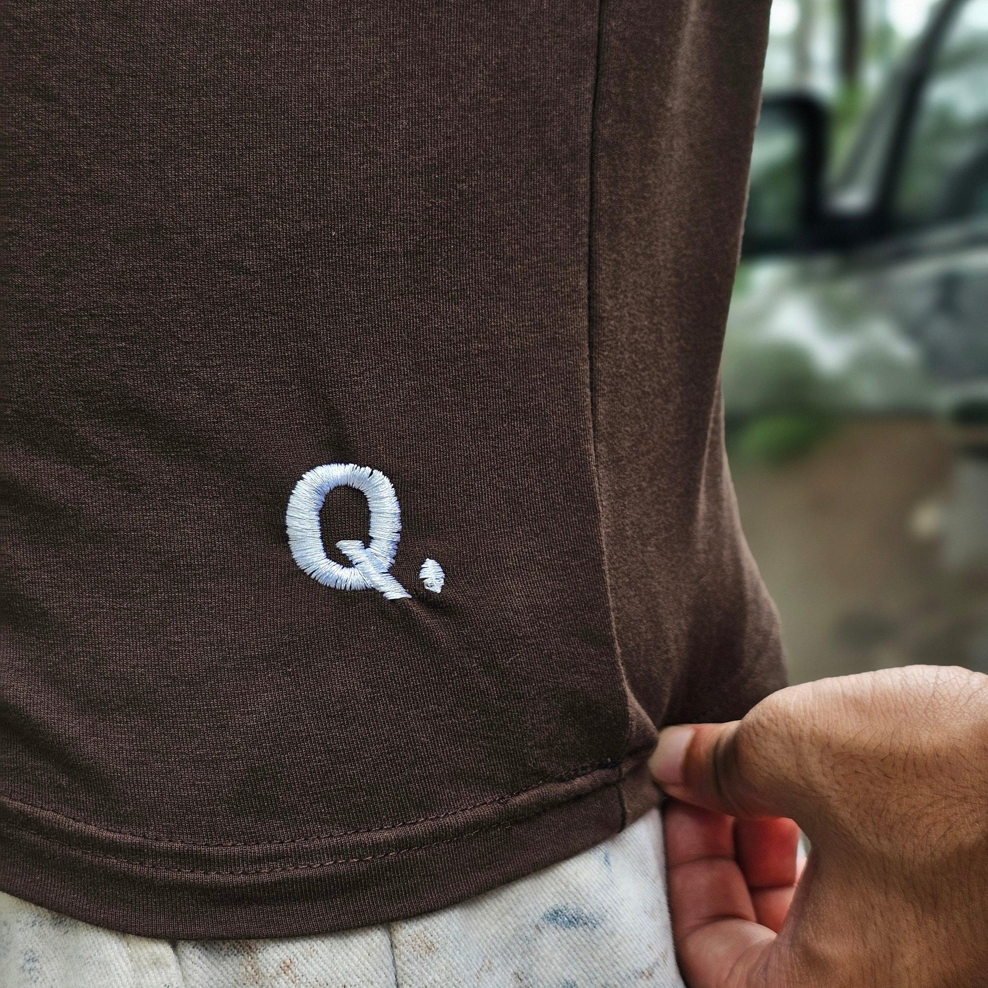 Brown fabric with a white logo on a blurred background